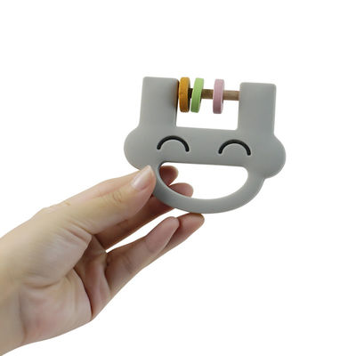 Lächeln-Gesichts-fertigen nettes Silikon-Kinderspielwaren-Silikon-Geklapper Beißring mit Logo Soem-ODM besonders an