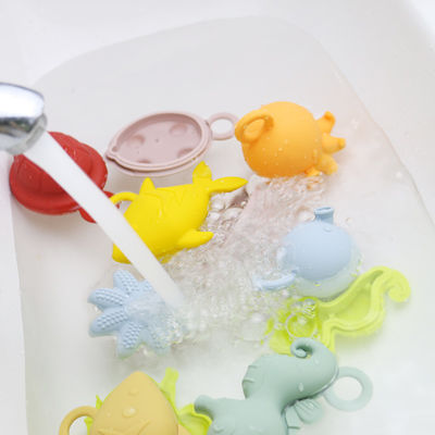 Neuzugangkinderkinder, die Bad Silikonspielwaren bpa freie Nahrungsmittelgradzahnensilikonwasserspielwaren schwimmen