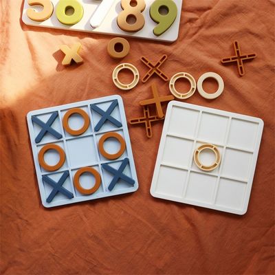 MOQ 50 Sets Silikon XO Tic Tac Toe Puzzle Anpassungsfähige Logofarben BPA-frei CE-Zertifikat Silikonspielzeug